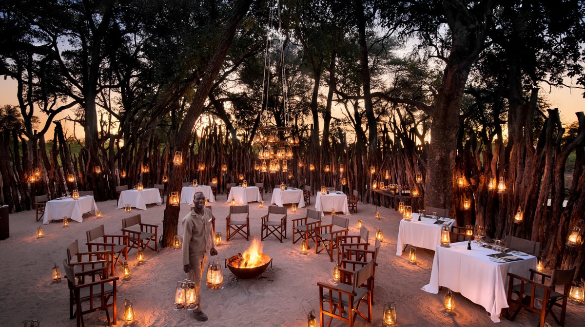 Botswana-andBeyondNxabega-Okavango-Tented-Camp-Guest-Area-Boma-with-staff