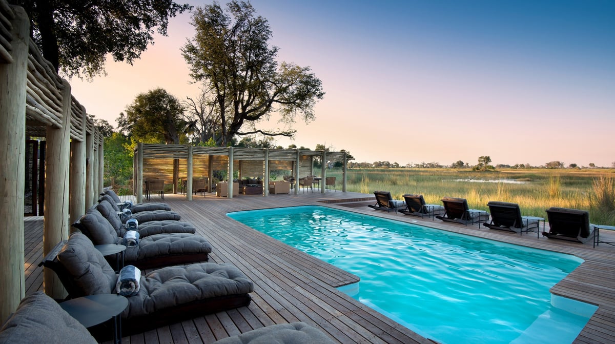 Botswana-andBeyondNxabega-Okavango-Tented-Camp-Guest-Area-lounging-at-the-pool