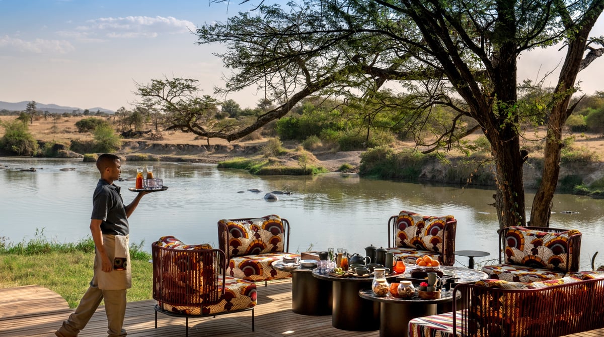 Tanzania-andbeyond-Grumeti-Serengeti-River-Lodge-Guest-Area-lounge-afternoon-tea-setup-Beyonder-butler