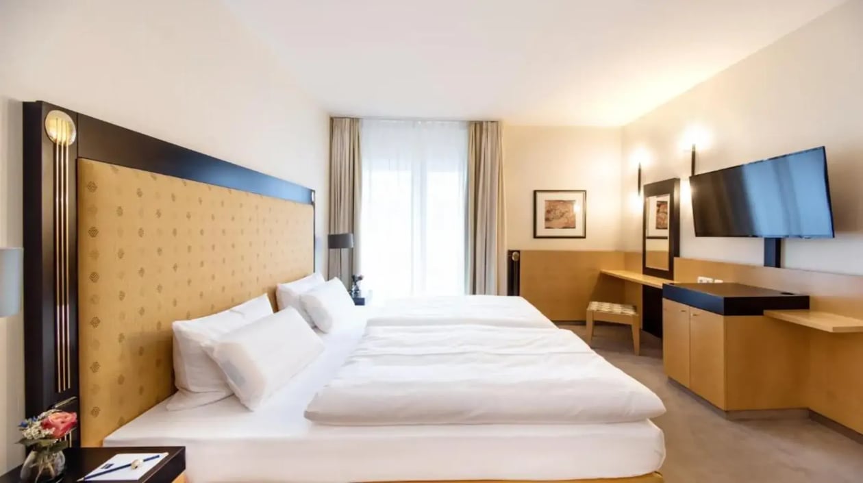 Impressie slaapkamer Deluxe Suite Dorint Charlottenhof Halle (1)